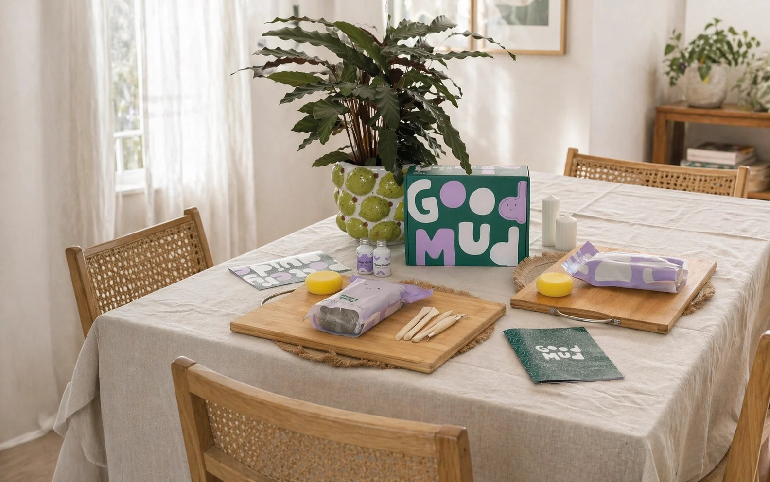 Dining table with a Good Mud at home pottery kit